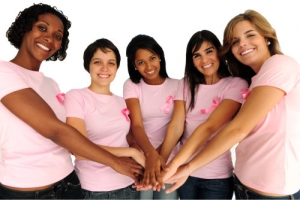 group of women putting hands together